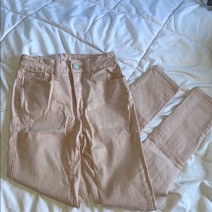 Distressed, light pink jeans